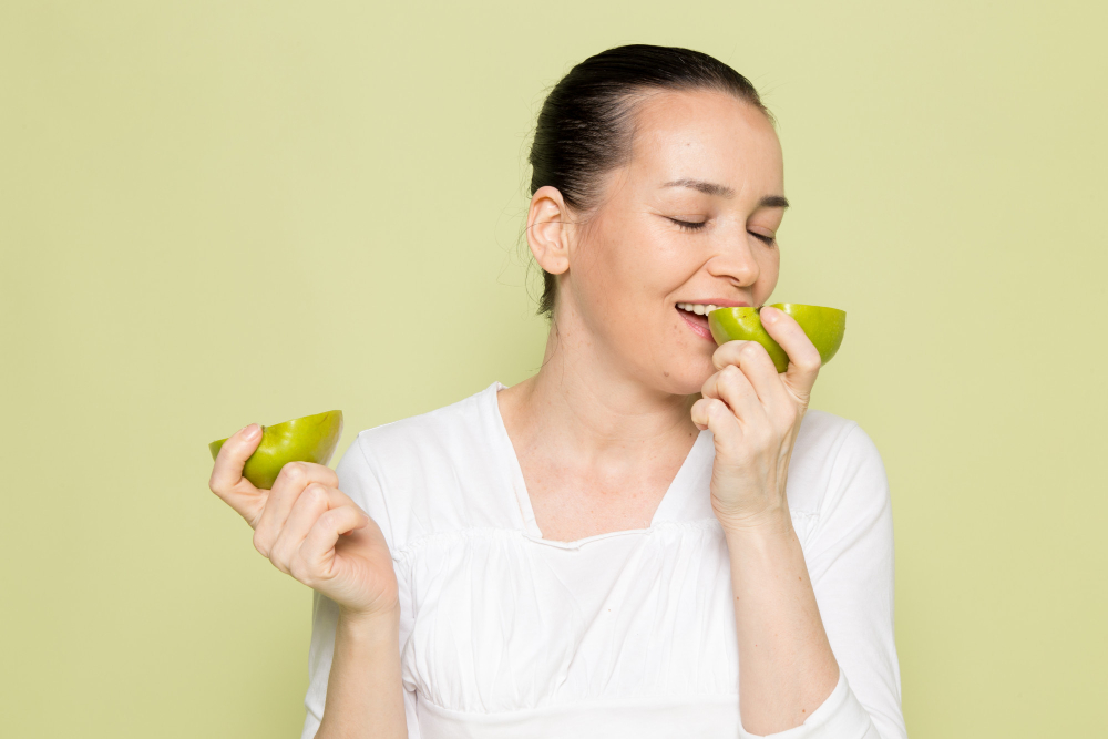 Women Eating Green Apples